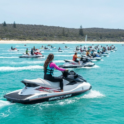 Licensed jet ski rider participating in an organized group event on a vibrant Australian coastline