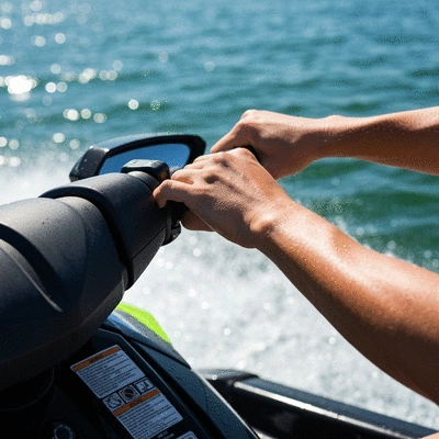 Close-up of jet ski controls, throttle, and handlebars, in use on the water, no text, no words, no typography, clean image